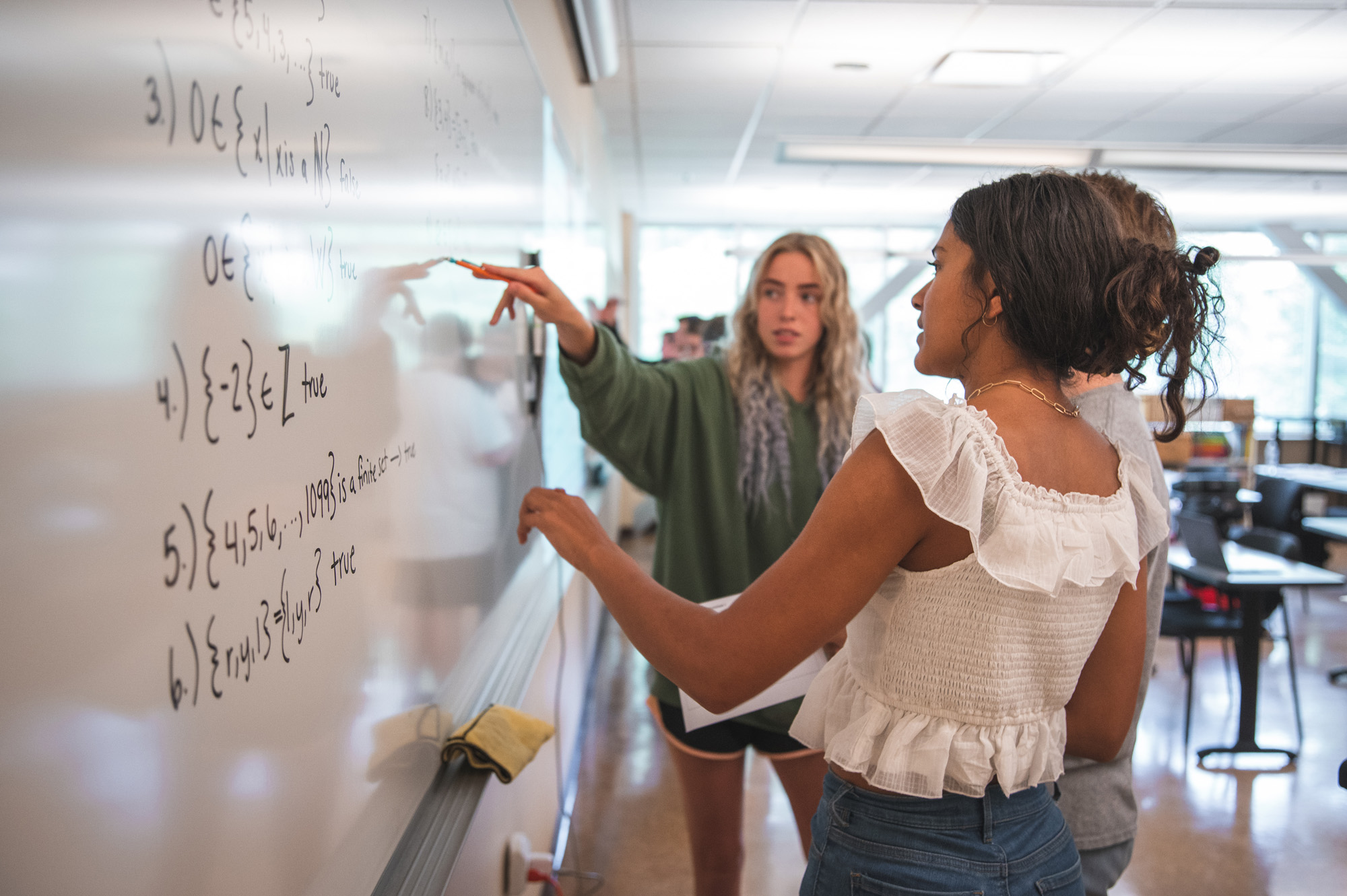 Students at a whiteboard.