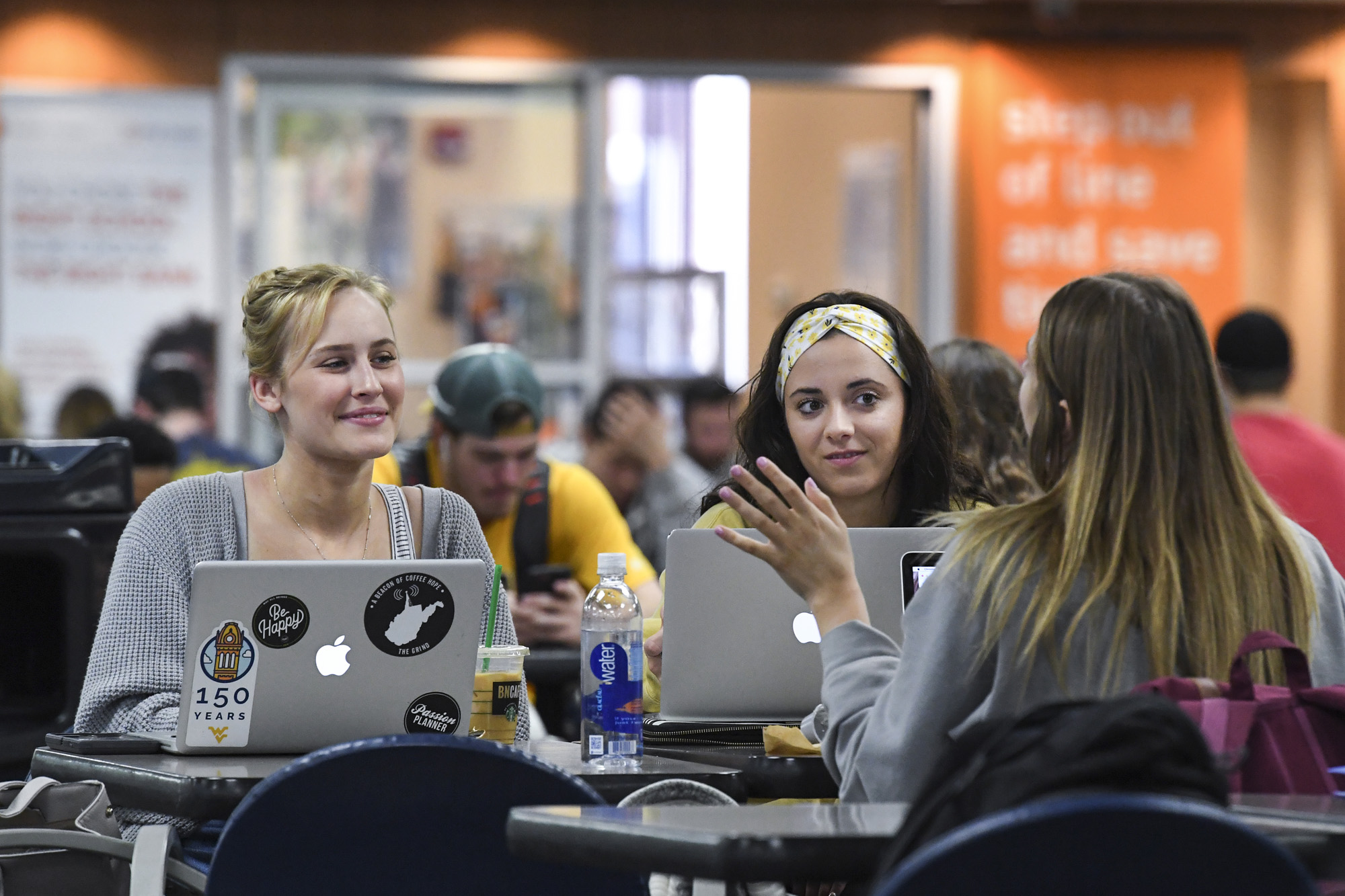 Students sitting in food court.