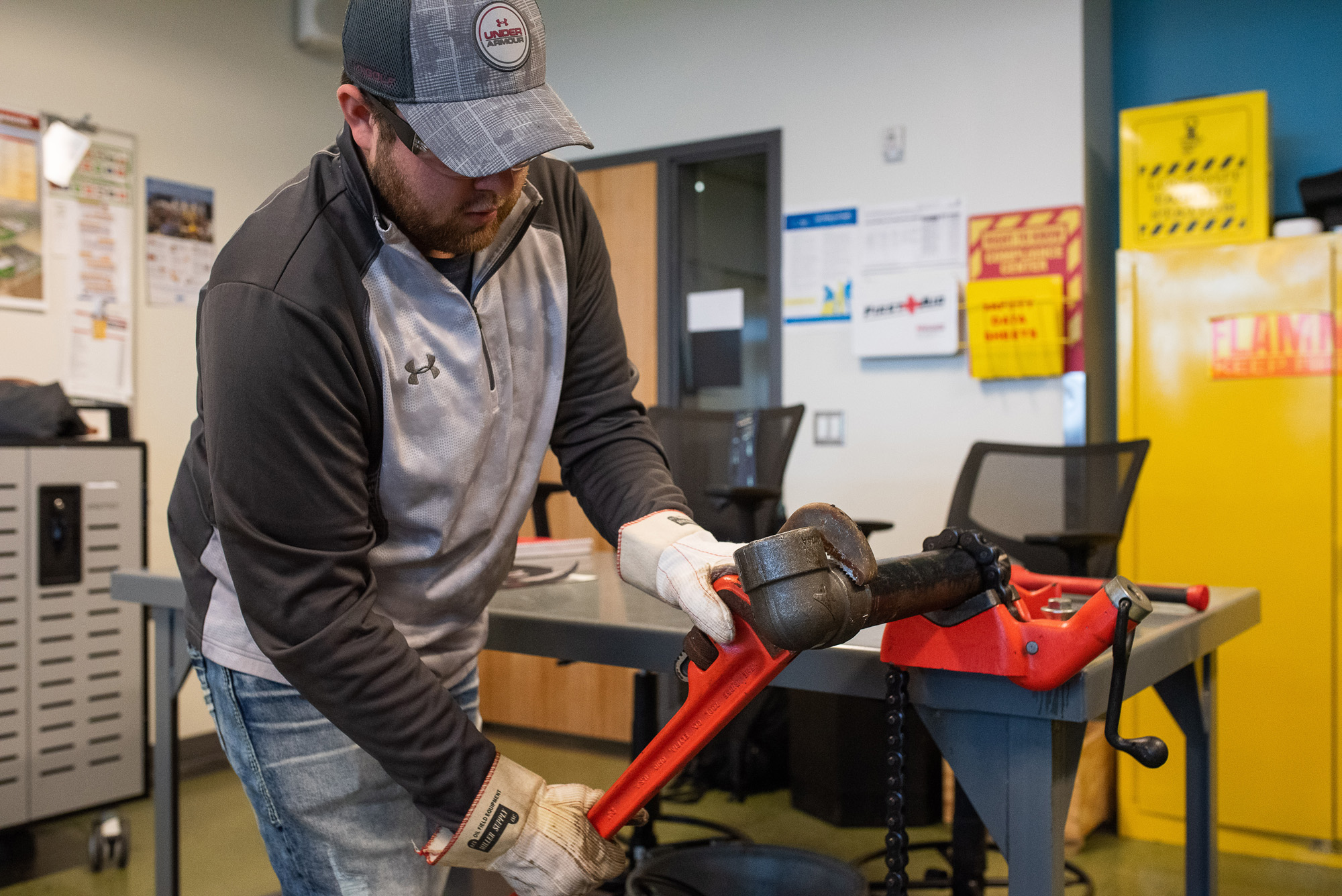 Student with pipe wrench.
