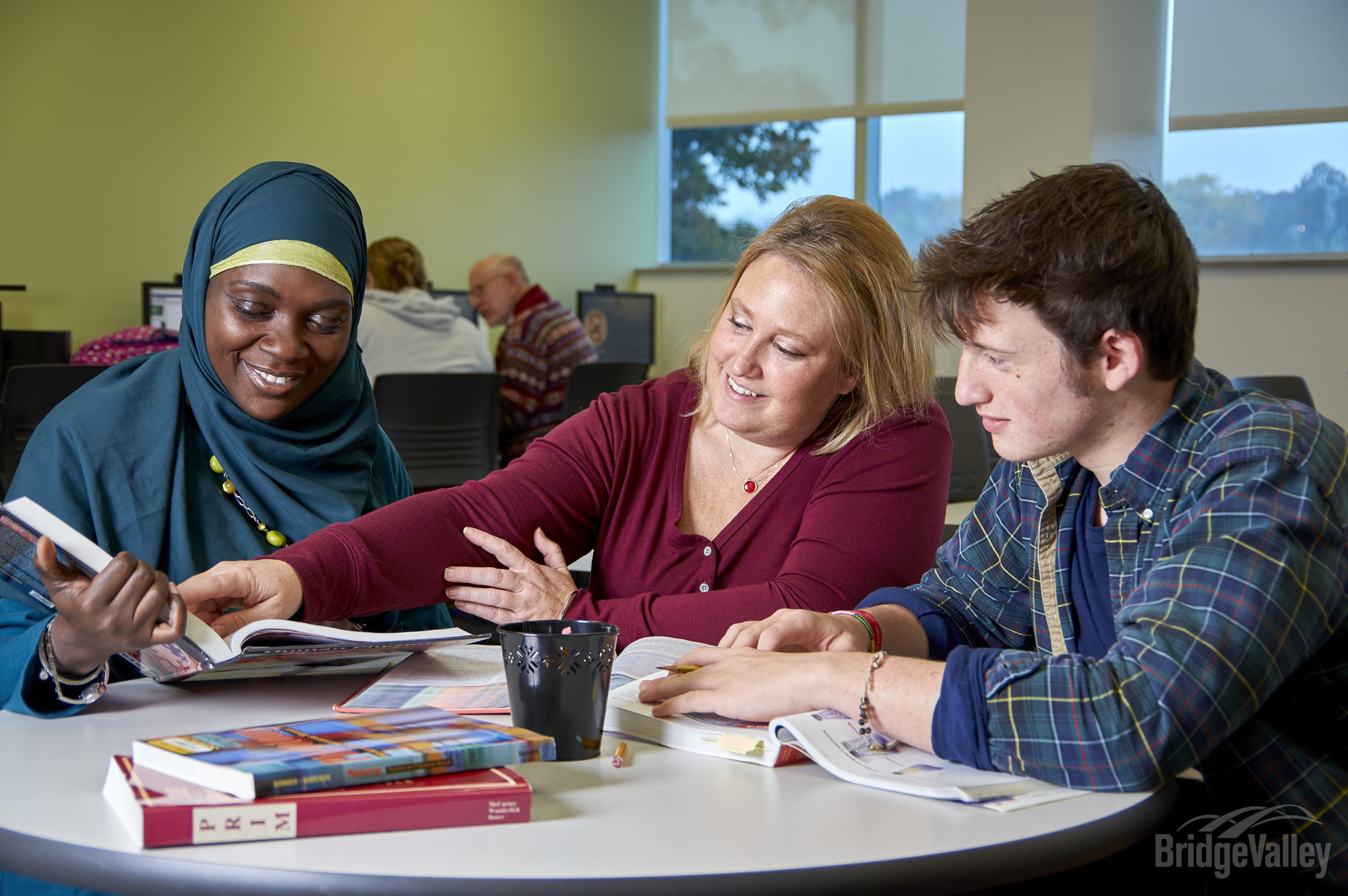 Students sitting at table.