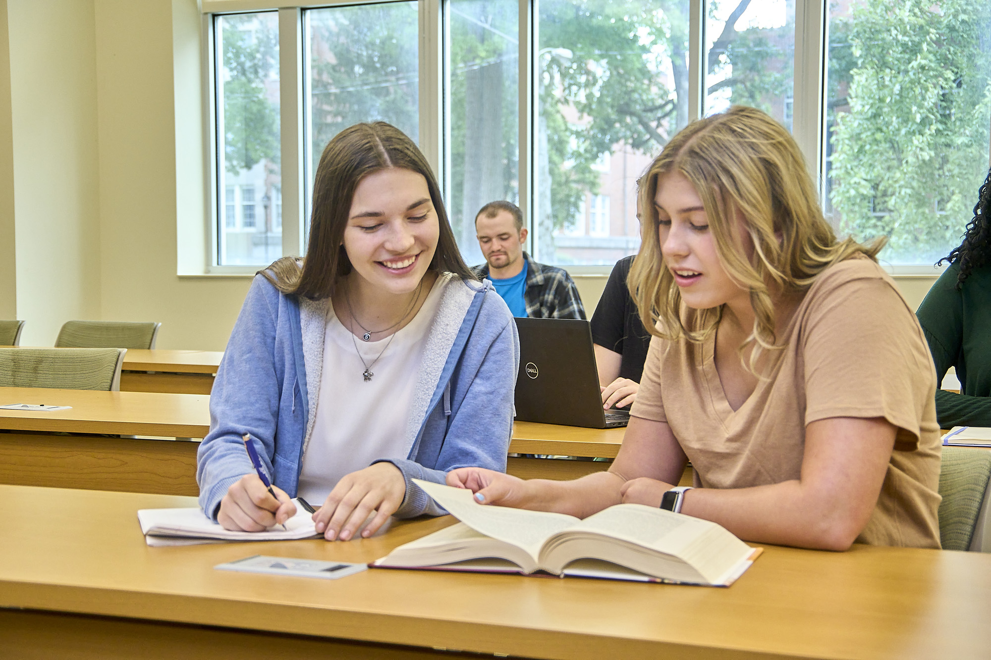 Students at a desk.