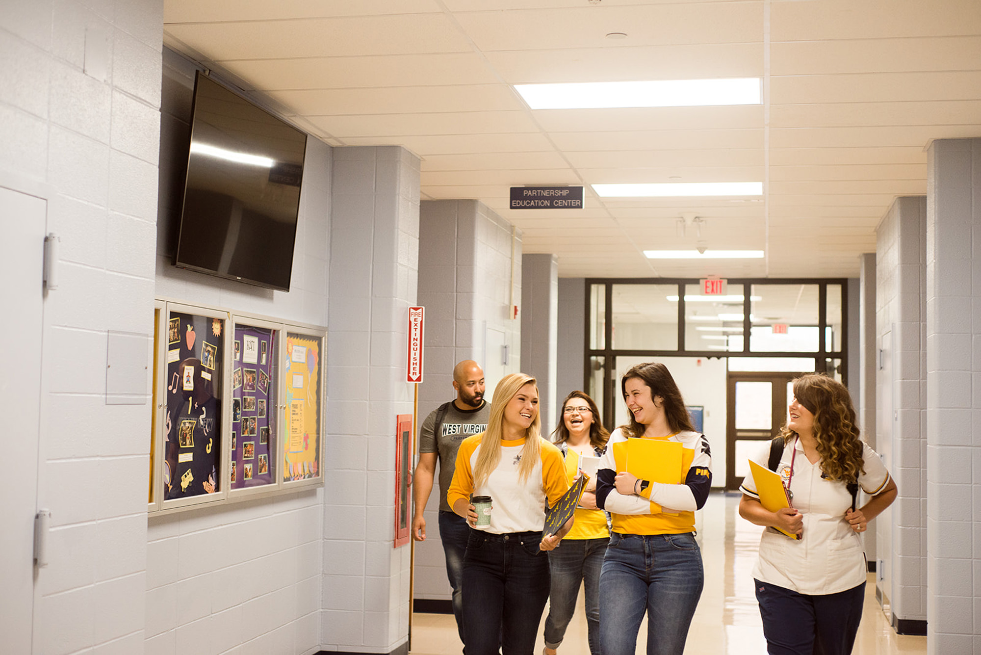 Students walking down a hall.