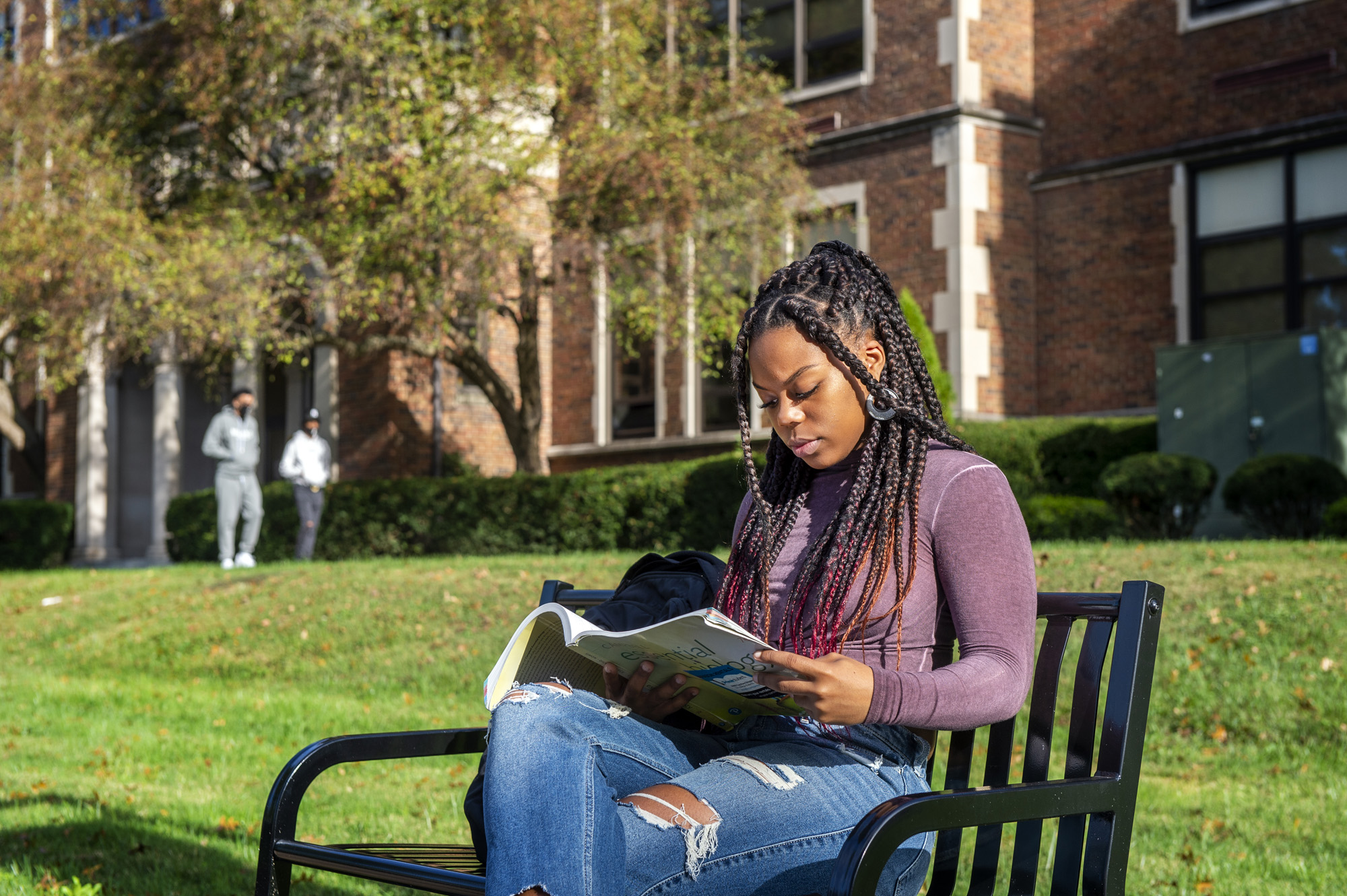 Student sitting on bench.
