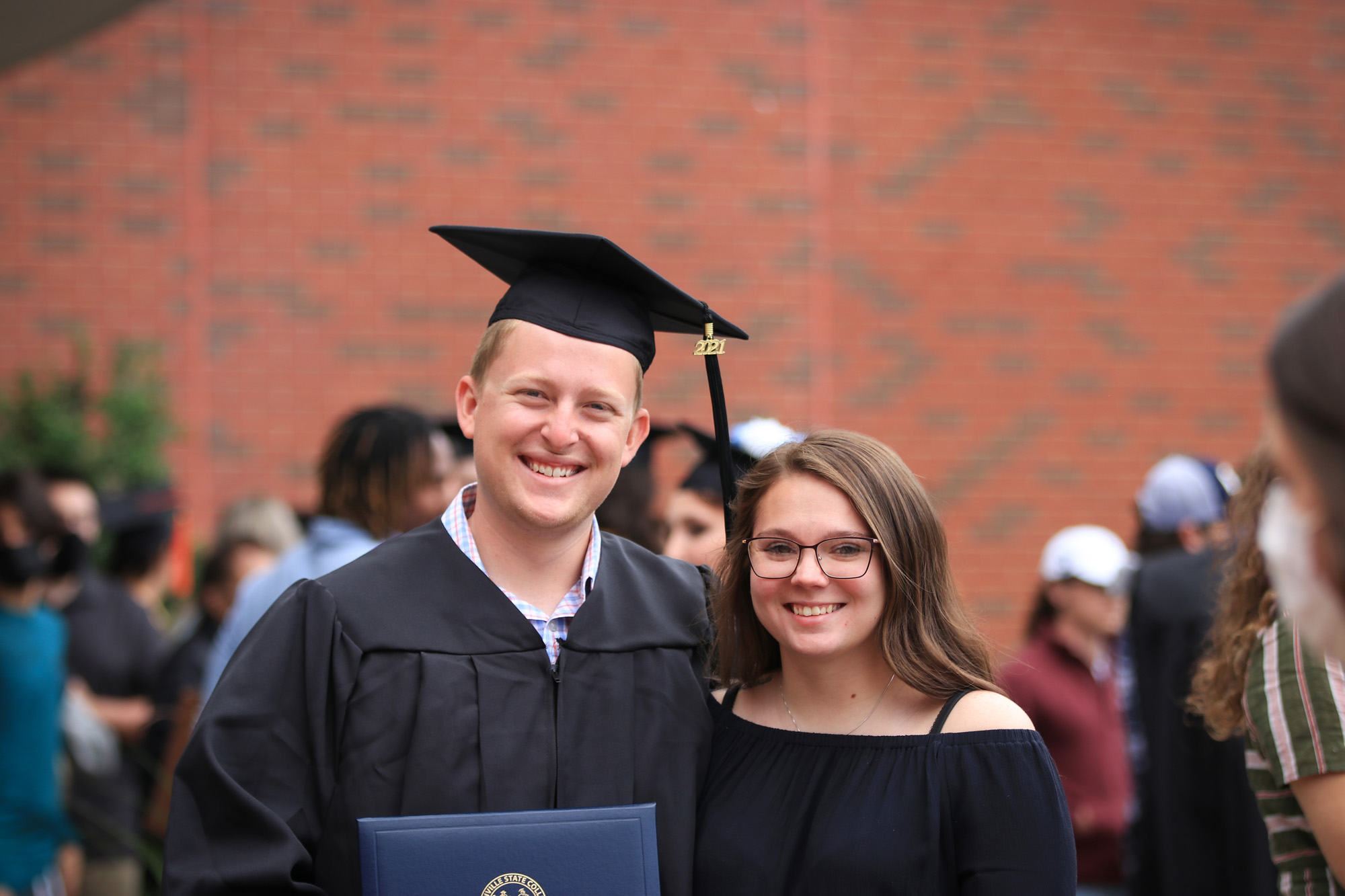 Grad posing for picture.