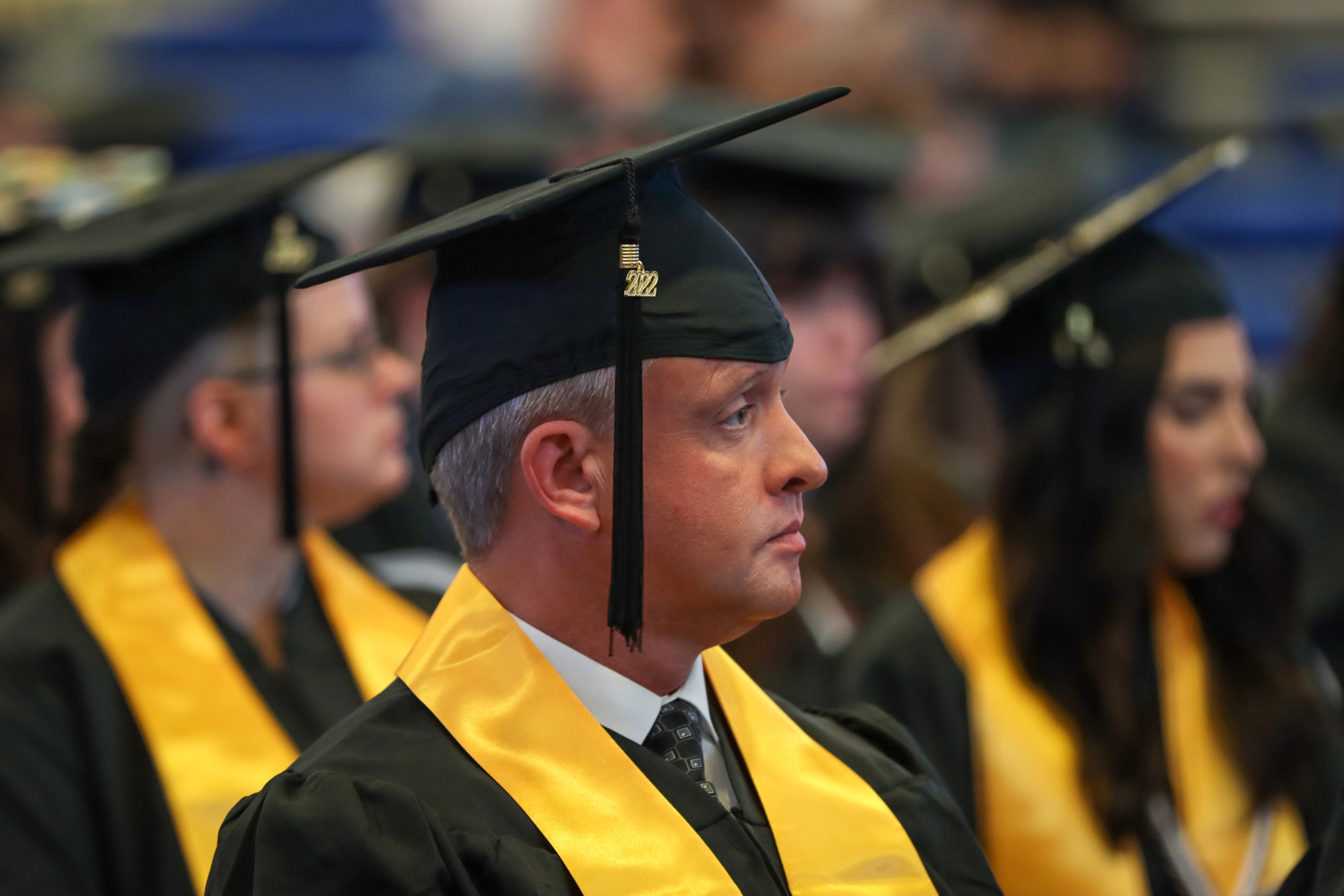 Man in grad cap and gown.