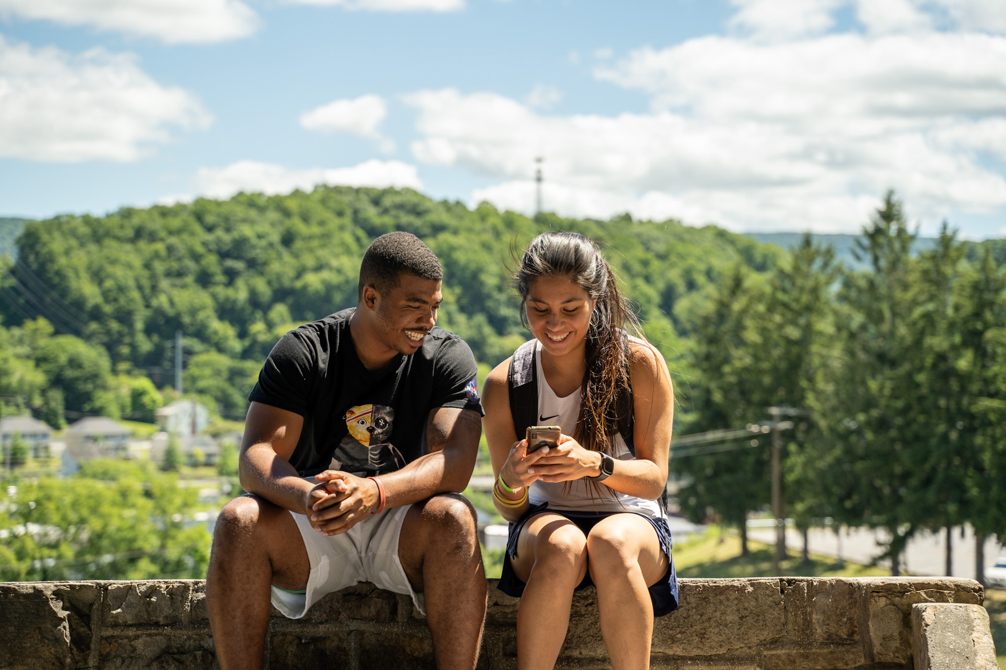 Students sitting together outside.
