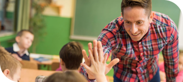 Teacher giving a high five to a student.