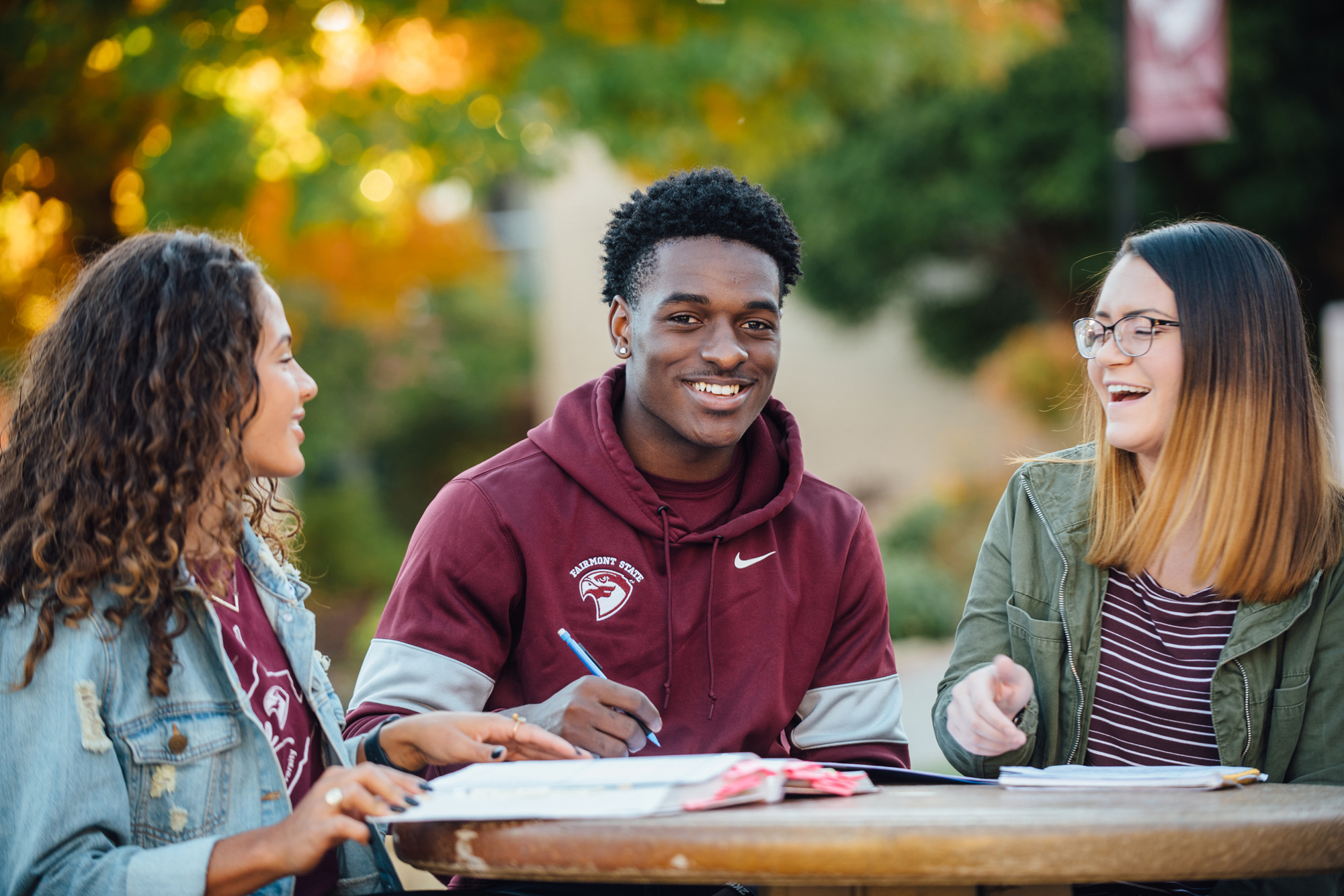 Students laughing together outside.