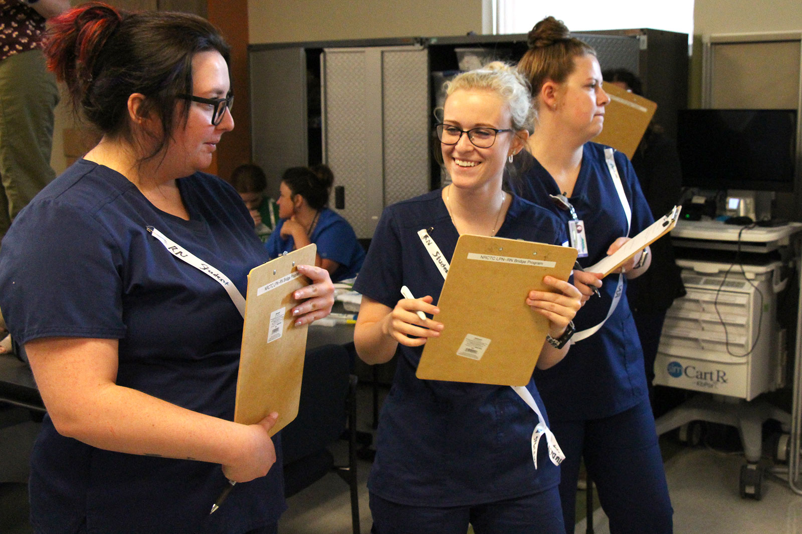 Students with clipboards.